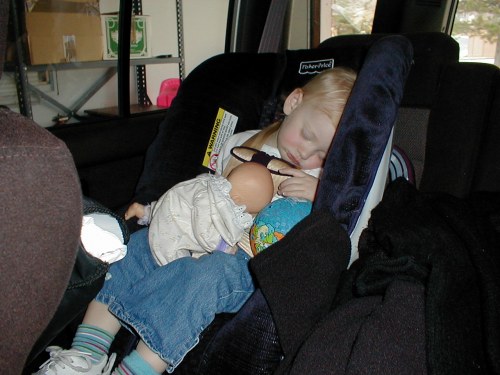 My big sister asleep in the car.  That visit to the hospital really tuckered her out!  Taken Nov. 8, 2001.